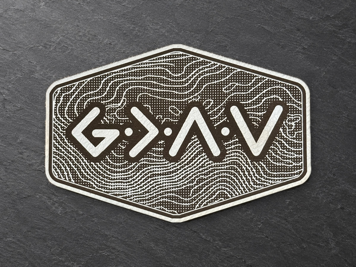 God Is Greater Than the Highs and Lows patch, sky blue and dark topographic hexagonal patch