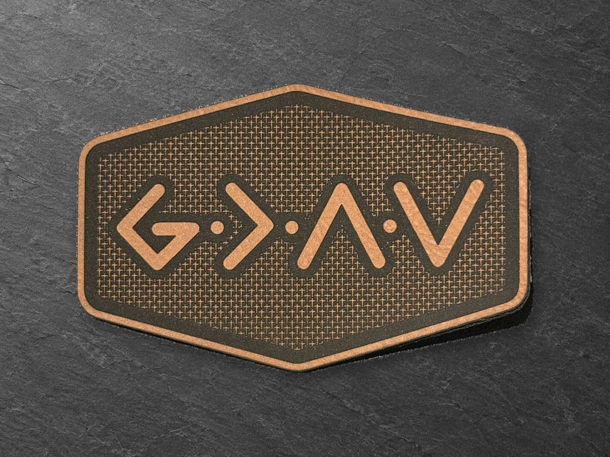 God Is Greater Than the Highs and Lows patch, copper and dark topographic hexagonal patch